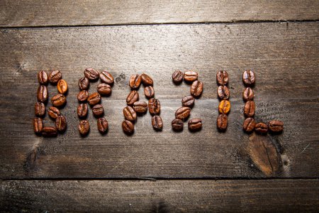 Photo for Written "brazil" on wooden boards with coffee beans - Royalty Free Image
