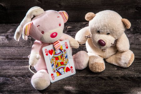 Photo for Teddy bears with card on wooden floor - Royalty Free Image