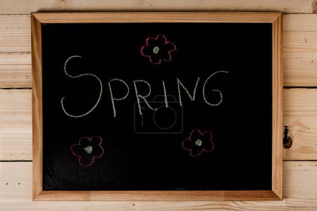 Photo for Chalkboard with the inscription 'spring' - Royalty Free Image