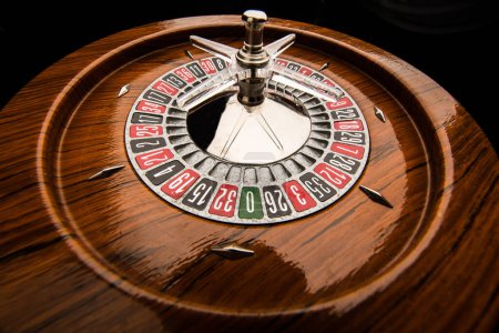 Photo for Wooden roulette isolated on black background - Royalty Free Image
