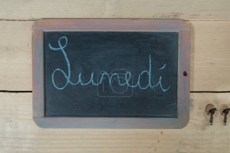 Photo for Chalkboard with the inscription on a wooden background - Royalty Free Image