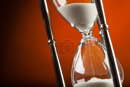 Photo for Hourglass on dark background. concept of time management - Royalty Free Image