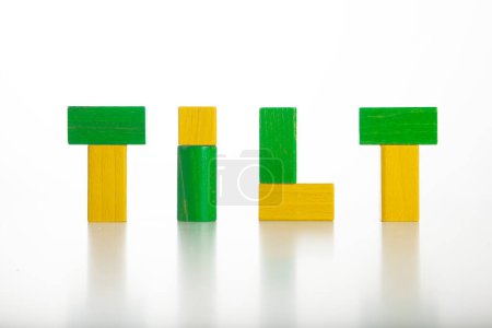 Photo for Word " tilt" written with wooden cubes on the white background - Royalty Free Image