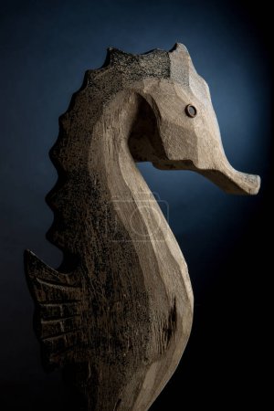 Photo for A wooden sculpture of a horse on a black background - Royalty Free Image