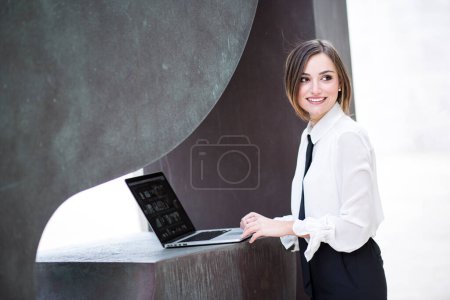Photo for Blonde female manager with bob hair, white shirt - Royalty Free Image