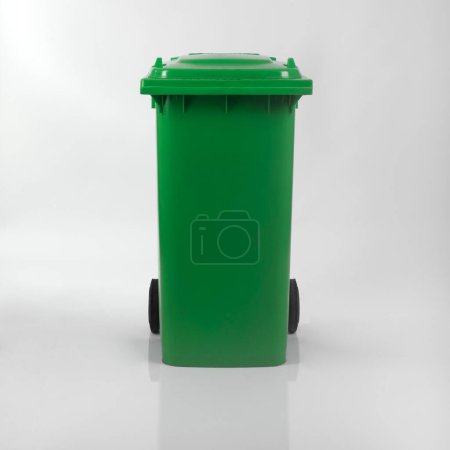 Photo for Green plastic trash can on white background - Royalty Free Image