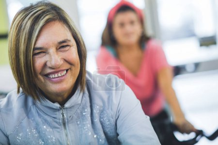 Photo for Portrait of smiling senior woman in gym - Royalty Free Image
