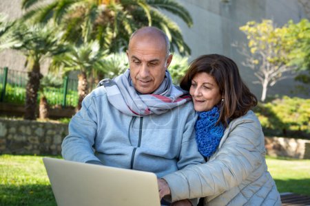 Photo for Couple in the city with laptop - Royalty Free Image