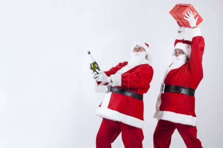 Photo for Couple of Santa Clauses on white background, Christmas concept - Royalty Free Image