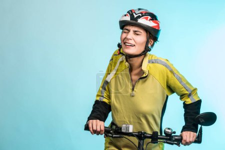 Photo for Smiling woman cyclist in the technical helmet, isolated on light background - Royalty Free Image