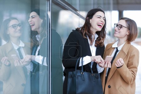 Photo for Two businesswomen on street near business building - Royalty Free Image
