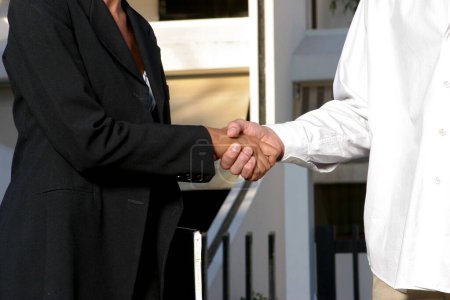 Photo for Two businessmen shaking hands - Royalty Free Image