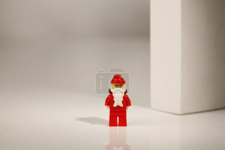 Photo for Cagliari, Italy 12 January 2011: lego figures in santa costumes on black background - Royalty Free Image