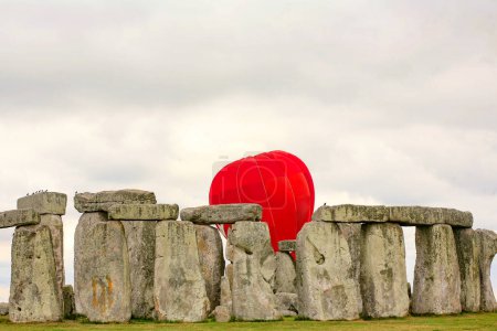 Photo for Red balloon in a rocks - Royalty Free Image