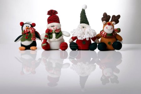 Photo for Christmas dolls reflexed on the white - Royalty Free Image