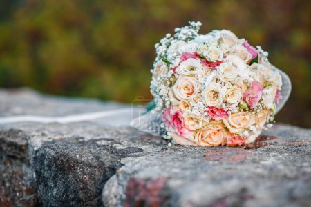 Photo for Beautiful colorful wedding bouquet on a stone wall - Royalty Free Image