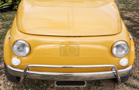 Photo for Yellow vintage car on the street. retro car - Royalty Free Image