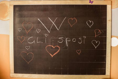 Photo for Chalkboard with love message and hearts - Royalty Free Image