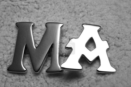 Photo for MA metal letters on table in black and white - Royalty Free Image