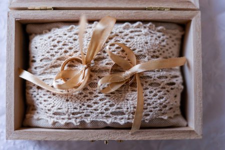 Photo for A closeup shot of a decorative present box with beautiful scarf tied with gift ribbon - Royalty Free Image