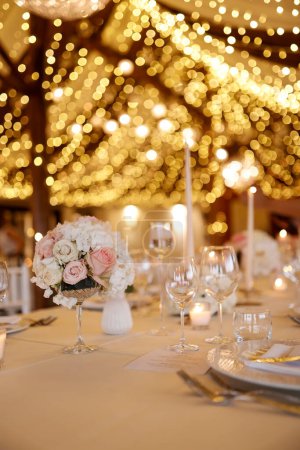 Photo for Wedding table setting with candles and flowers. - Royalty Free Image