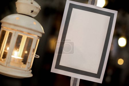 Photo for Blank empty picture frame and lantern - Royalty Free Image