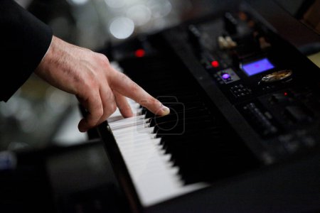 Photo for Hands of the musician with a piano. - Royalty Free Image