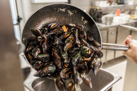 Photo for Mussels in a pan. - Royalty Free Image