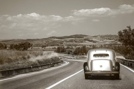 Photo for Old car in a country road - Royalty Free Image