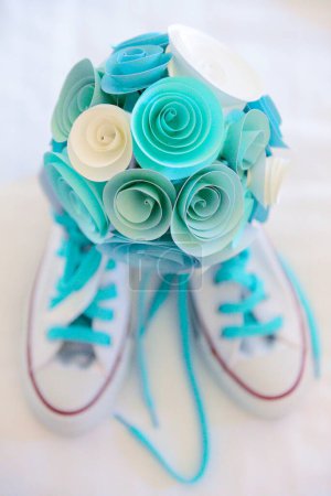 Photo for Baby shoes and flowers - Royalty Free Image