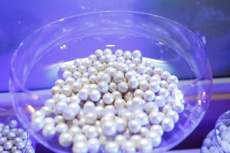 Photo for White pearls in glass bowl - Royalty Free Image