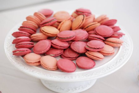 Photo for Sweet french macarons on white plate - Royalty Free Image