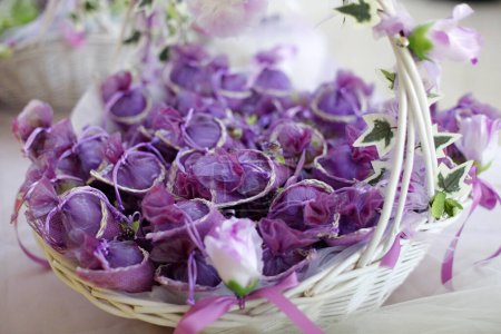 Photo for Bouquet of purple flowers in basket - Royalty Free Image