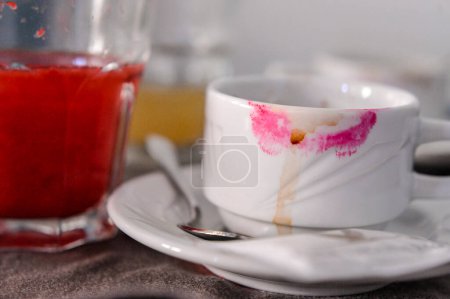 Photo for Close-up view of white coffee cup with lipstick on a table - Royalty Free Image