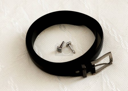 Photo for Groom's belt and cufflinks, black and white - Royalty Free Image