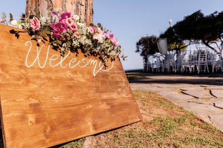 Photo for Welcome to the wedding ceremony in the park - Royalty Free Image