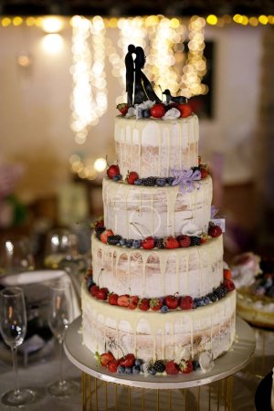 Photo for Wedding cake with fruits and decorations - Royalty Free Image