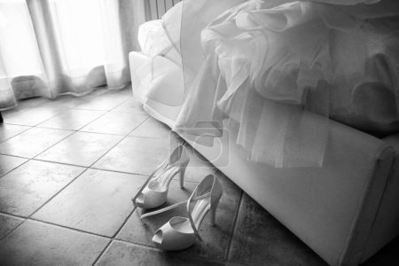 Photo for Black and white photo of wedding dress and shoes - Royalty Free Image