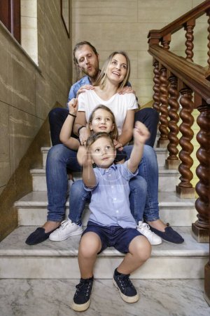 Photo for Happy smiling family with two children in the room - Royalty Free Image