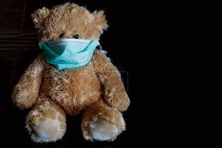 Photo for Teddy bear with mask for Coronavirus - Royalty Free Image