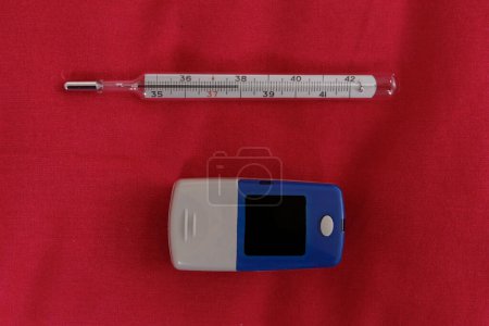 Photo for Oximeter and thermometer - Coronavirus tools - Royalty Free Image