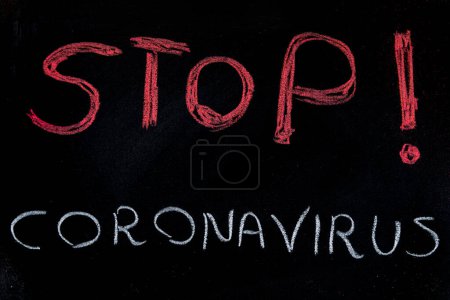 Photo for Blackboard with Stop Coronavirus written on it - Royalty Free Image