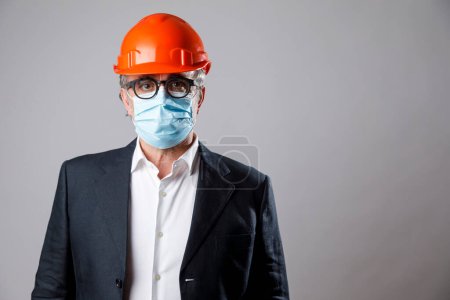Photo for Engineer with protective helmet and mask isolated on white background - Royalty Free Image