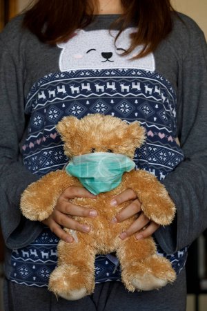 Photo for Teddy bear with mask for Coronavirus - Royalty Free Image