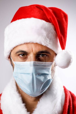 Photo for Santa Claus with surgical mask, isolated on white background - Royalty Free Image