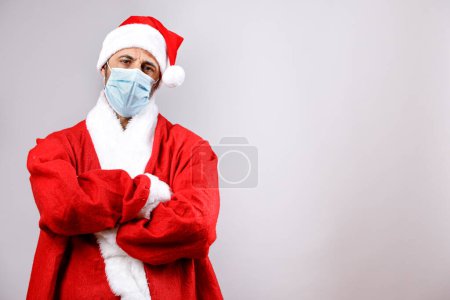 Photo for Abbo christmas with surgical mask crosses arms, isolated on white background - Royalty Free Image