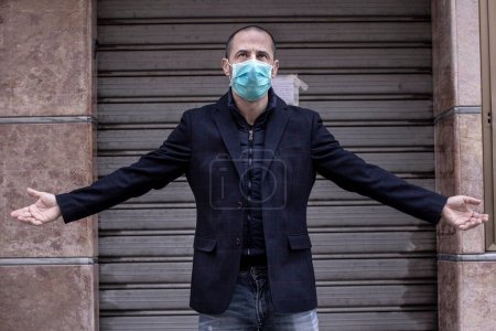 Photo for Shaved man with face mask and jacket - Royalty Free Image