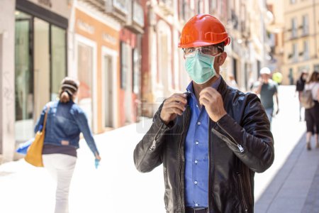 Photo for Man with protective helmet dressed casual is ready to work - Royalty Free Image
