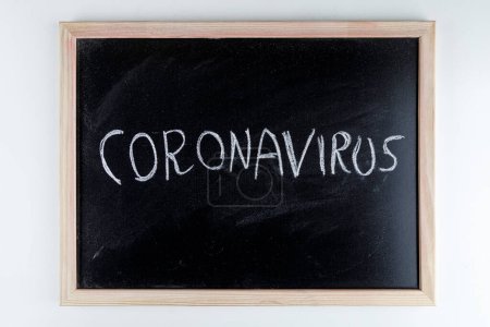 Photo for Blackboard with coronavirus and other medical elements related to the pandemic - Royalty Free Image