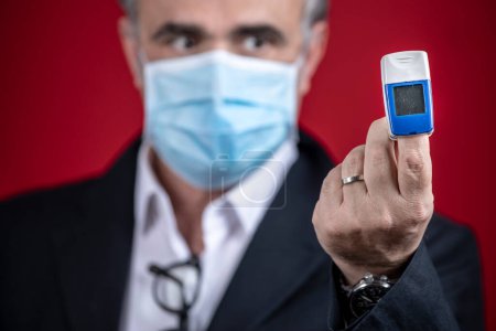 Photo for Portrait of man wearing a surgical mask isolated on background - Royalty Free Image